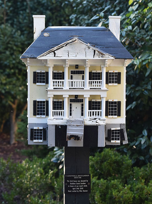 A birdhouse on the grounds of the Governor's mansion gardens