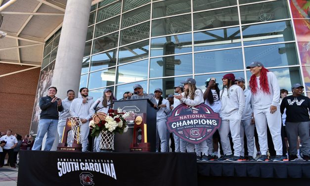 Excited fans welcome women’s basketball team home after championship win