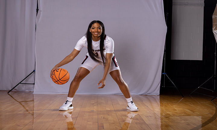 Zia Cooke poses with basketball on Carolina's Media Day