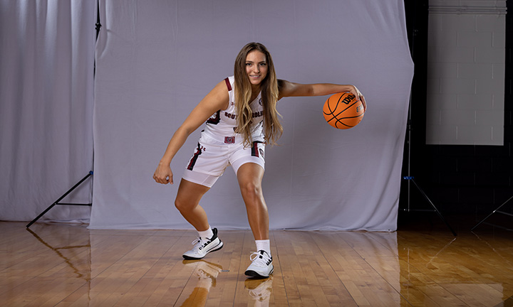 Olivia Thompson poses with basketball on Carolina's Media Day