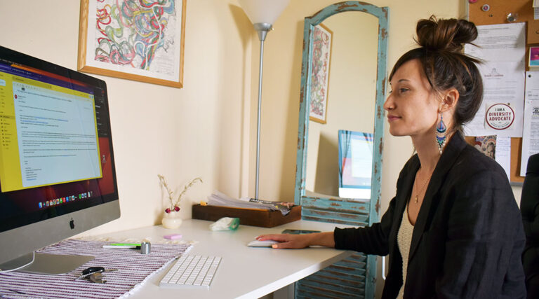Professor Monica Barra working at her desk.