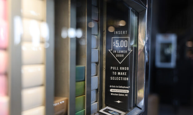 A retired cigarette vending machine now sells art at the Moxy Marriott