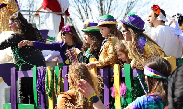 A ‘community full of love’ in purple, green and gold