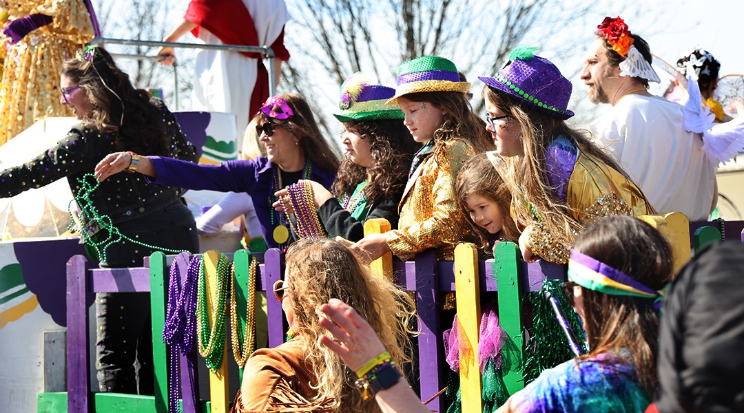 A ‘community full of love’ in purple, green and gold